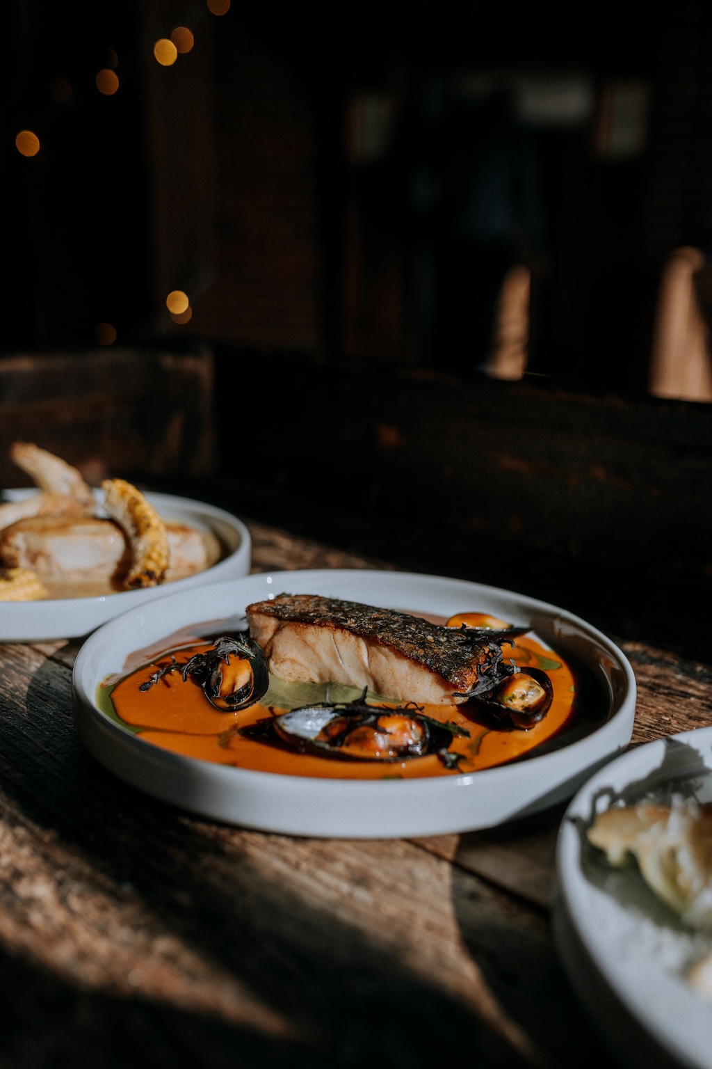 Delicious wedding salmon dish arranged on a rustic vintage dresser