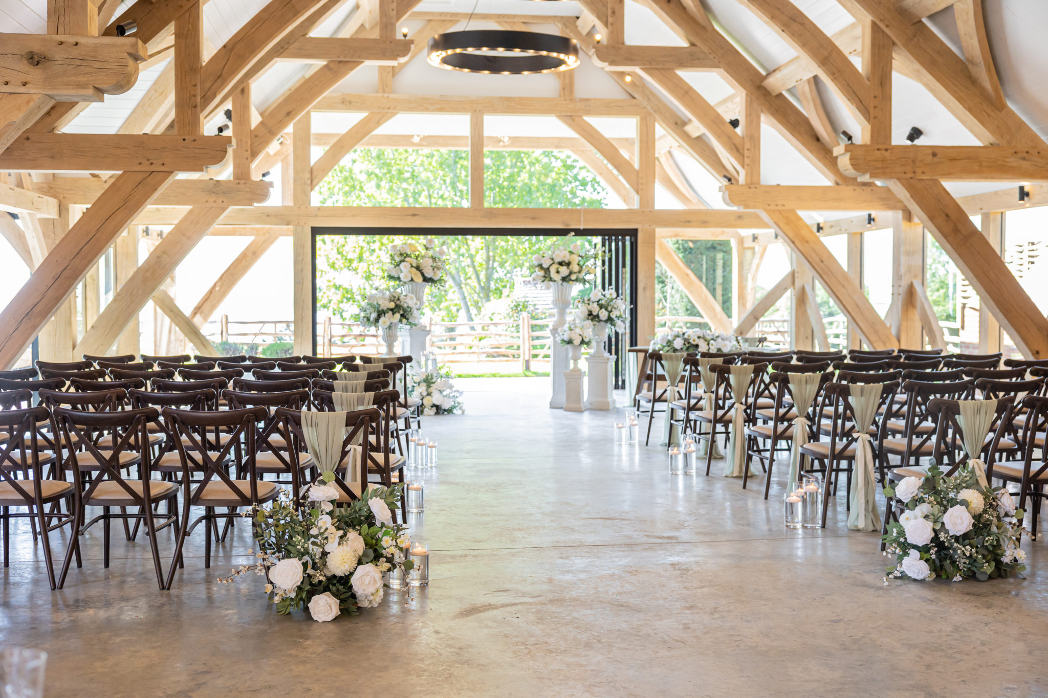 Barn dressed for a wedding ceremony with open doors towards the Kent estuary