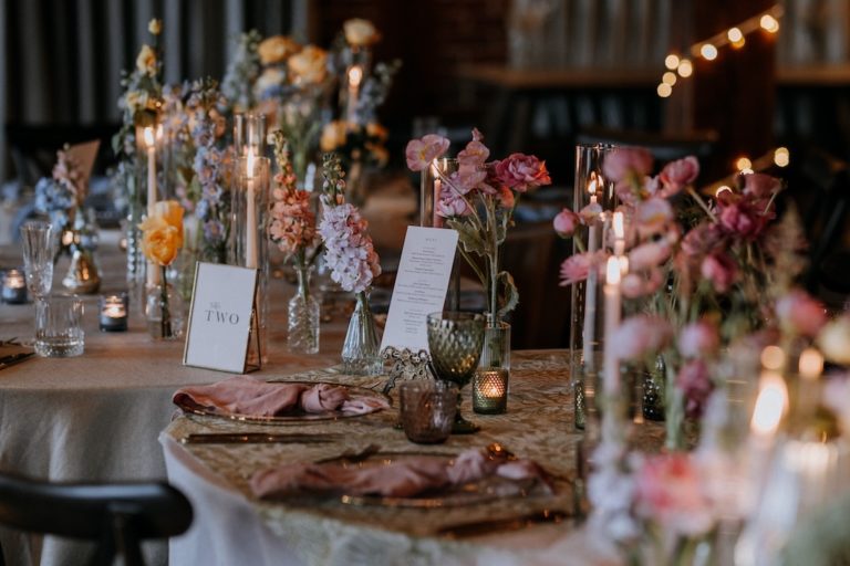 Close up of a wedding caterpillar tables dressed with spring flowers